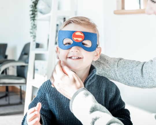 kid in super hero mask